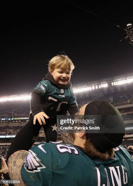 Chris Long of the Philadelphia Eagles celebrates with his son Waylon James Long after defeating the Minnesota Vikings in the NFC Championship game at...