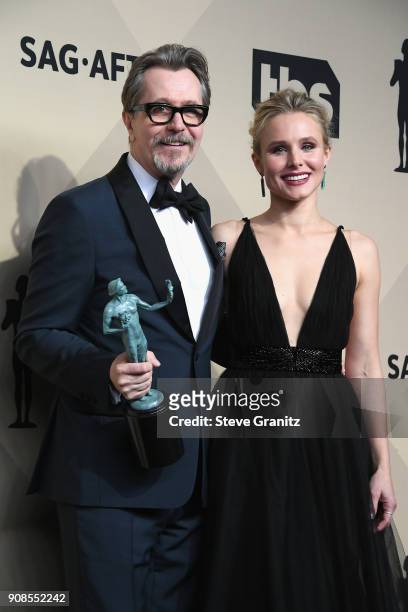 Actor Gary Oldman , winner of the award for Outstanding Performance by a Male Actor in a Leading Role for 'Darkest Hour,' poses with host Kristen...