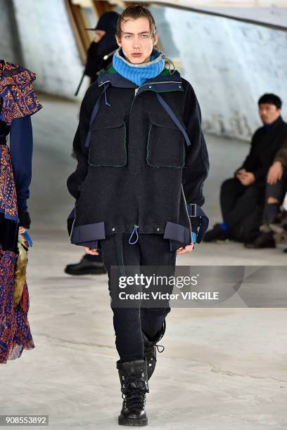 Model walks the runway during the Sacai Menswear Fall/Winter 2018-2019 show as part of Paris Fashion Week on January 20, 2018 in Paris, France.