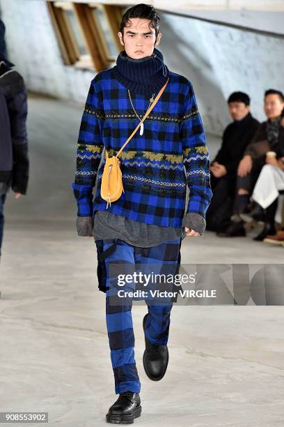 Model walks the runway during the Sacai Menswear Fall/Winter 2018-2019 show as part of Paris Fashion Week on January 20, 2018 in Paris, France.