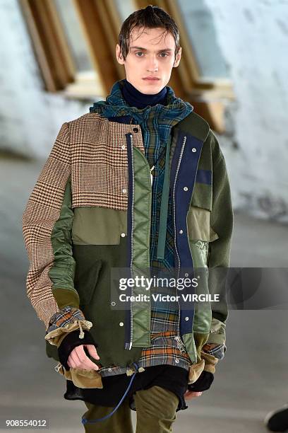 Model walks the runway during the Sacai Menswear Fall/Winter 2018-2019 show as part of Paris Fashion Week on January 20, 2018 in Paris, France.