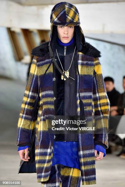 Model walks the runway during the Sacai Menswear Fall/Winter 2018-2019 show as part of Paris Fashion Week on January 20, 2018 in Paris, France.