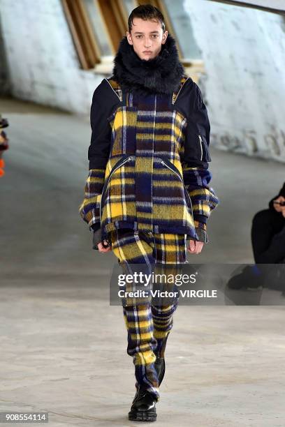 Model walks the runway during the Sacai Menswear Fall/Winter 2018-2019 show as part of Paris Fashion Week on January 20, 2018 in Paris, France.