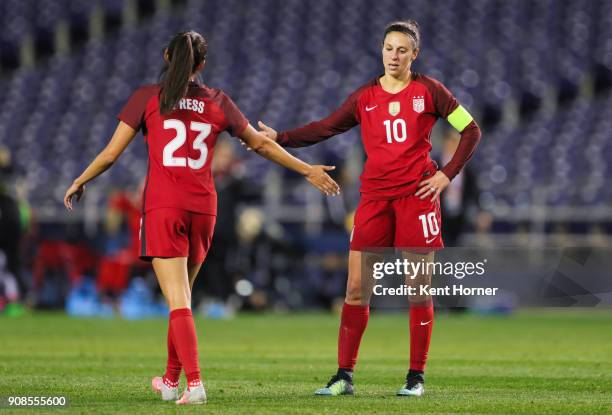 Carli Lloyd and Christen Press of the U.S. Women's national team high-five after the conclusion of the game against the Danish women's national team...