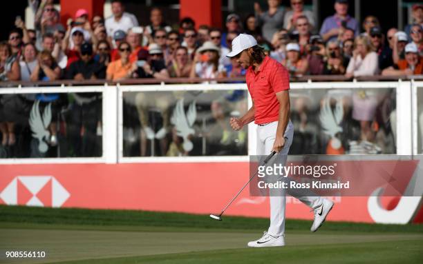 Tommy Fleetwood of England celebrates his birdie putt on the 18th green during the final round of the Abu Dhabi HSBC Golf Championship at Abu Dhabi...