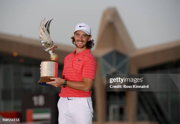 Tommy Fleetwood of England celebrates with the winners trophy after the final round of the Abu Dhabi HSBC Golf Championship at Abu Dhabi Golf Club on...