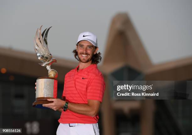 Tommy Fleetwood of England celebrates with the winners trophy after the final round of the Abu Dhabi HSBC Golf Championship at Abu Dhabi Golf Club on...