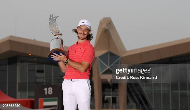 Tommy Fleetwood of England celebrates with the winners trophy after the final round of the Abu Dhabi HSBC Golf Championship at Abu Dhabi Golf Club on...