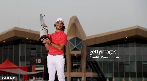 Tommy Fleetwood of England celebrates with the winners trophy after the final round of the Abu Dhabi HSBC Golf Championship at Abu Dhabi Golf Club on...