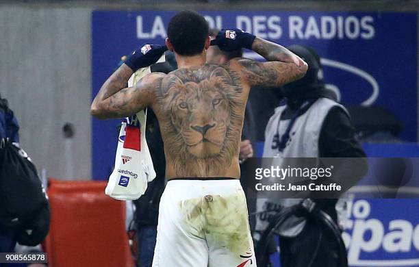 Shirtless and tattooed with a lion Memphis Depay of Lyon celebrates his winning goal at the last minute during the French Ligue 1 match between...