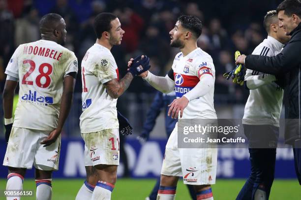 Memphis Depay and Nabil Fekir of Lyon celebrate the victory following the French Ligue 1 match between Olympique Lyonnais and Paris Saint Germain at...