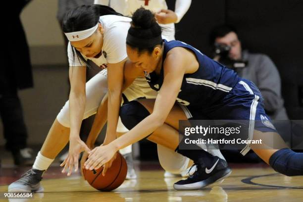 Temple Owls forward Mia Davis and Connecticut Huskies forward Azura Stevens battle for a loose ball during the second half on Sunday, Jan. 21, 2018...