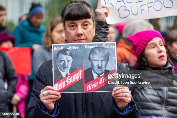 Protester associates the leader of Nazi Germany, Adolf Hitler, with current USA president Donald Trump at Portland's National March for Impeachment...