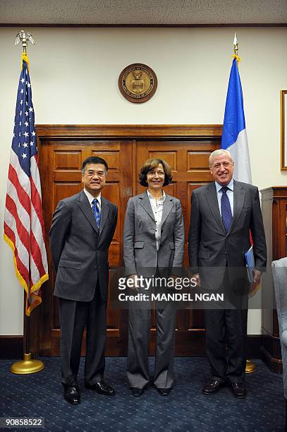 French Minister of State for Foreign Trade Anne-Marie Idrac poses with US Commerce Secretary Gary Locke and French Ambasador to the US Pierre Vimont...