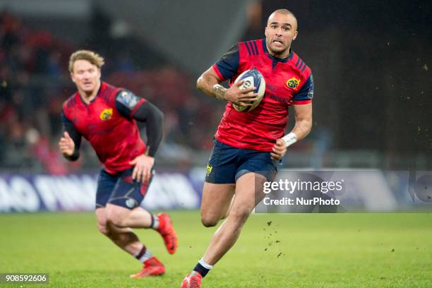 Simon Zebo of Munster runs with the ball during the European Rugby Champions Cup Round 6 match between Munster Rugby and Castres Olympique at Thomond...