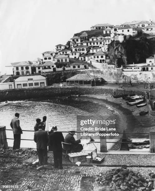 British statesman Winston Churchill paints the fishing village of Camara de Lobos, during a holiday in Madeira, 9th January 1950.