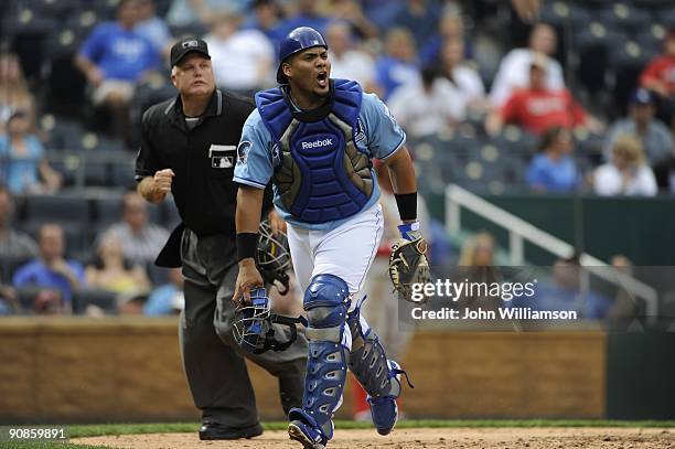 Catcher Brayan Pena of the Kansas City Royals fields his position as he reacts to a foul pop fly and calls it for the first baseman during the game...