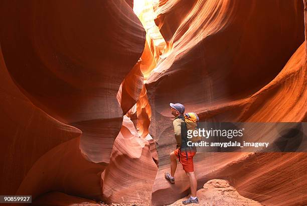 hiker sandstone desert slot canyon landscape - utah hiking stock pictures, royalty-free photos & images