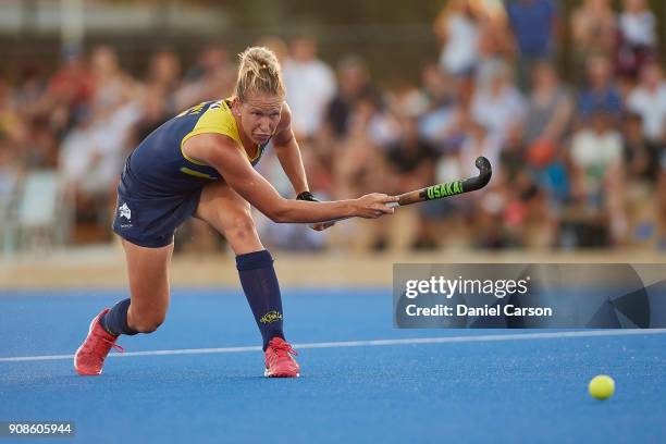 Jodie Kenny of the Hockeyroos hits the ball during game five of the International Test match series between the Australian Hockeyroos and Spain at...