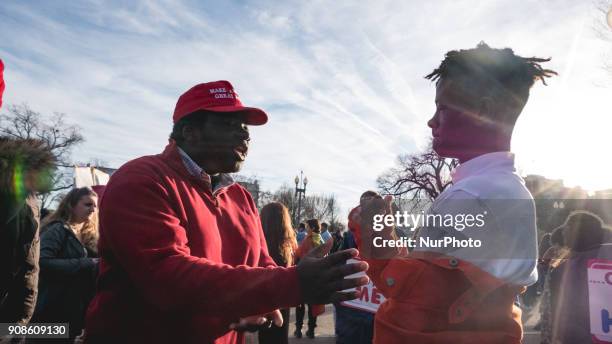 Sam, a 17-year-old Trump supporter from Washington, D.C., discusses why he supports the President, with 15-year-old Alton Barber, who doesn't support...