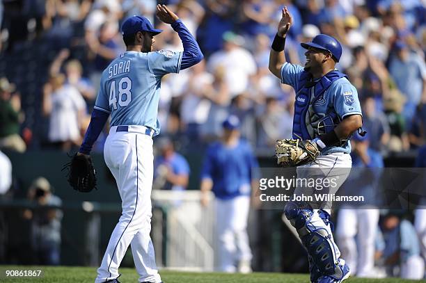 Pitcher Joakim Soria and catcher Brayan Pena#27 of the Kansas City Royals celebrate the final out and a win after the game against the Los Angeles...