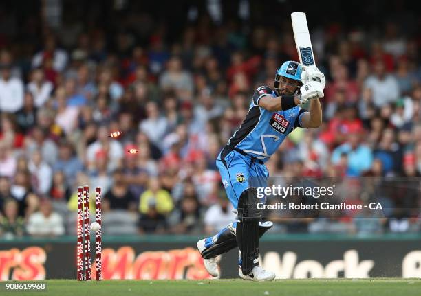 Jake Weatherald of the Strikers is bowled by Chris Tremain of the Renegades during the Big Bash League match between the Melbourne Renegades and the...