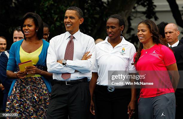 President Barack Obama and First Lady Michelle Obama watch a judo demonstration during an event on the South Lawn of the White House promoting the...