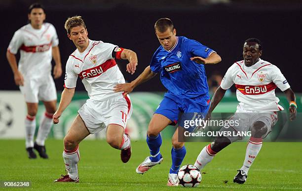 Stuttgart's defender from the Ivory Coast Arthur Boka and Stuttgart's midfielder Thomas Hitzlsperger vie for the ball with Rangers' French midfielder...