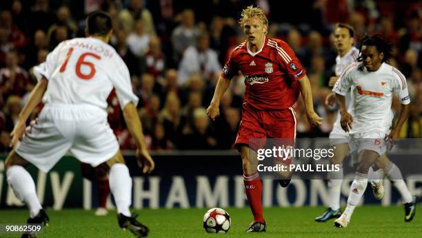 Liverpool's Dutch forward Dirk Kuyt runs towards Debrecen's Hungarian defender Adam Komlosi during their UEFA Champions League football match at...