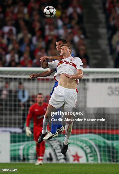 Pavel Pogrebnyak of Stuttgart battles for the ball with Lee McCulloch of Glasgow during the UEFA Champions League Group G match between VfB Stuttgart...