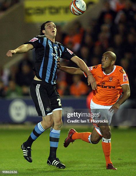 Andy Carroll competes with Alex Baptiste during the Coca-Cola League Championship match between Blackpool and Newcastle United at Bloomfield Road...