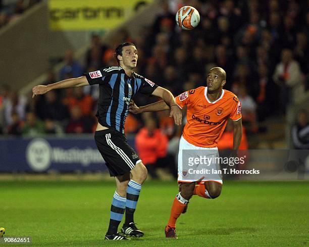 Andy Carroll competes with Alex Baptiste during the Coca-Cola League Championship match between Blackpool and Newcastle United at Bloomfield Road...