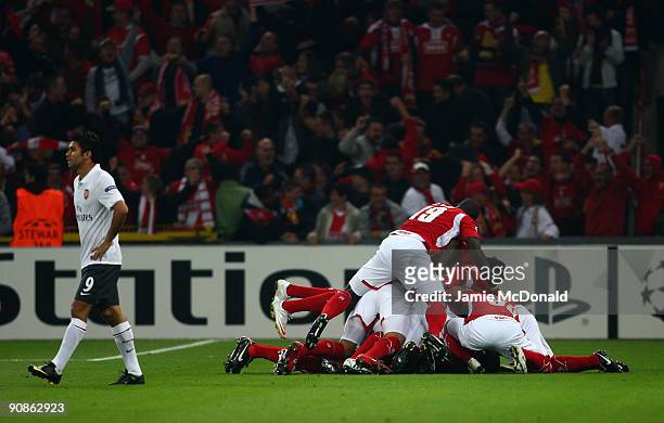 Standard Liege celebrate their first goal as Eduardo looks dejected during the UEFA Champions League Group H match between Standard Liege and Arsenal...