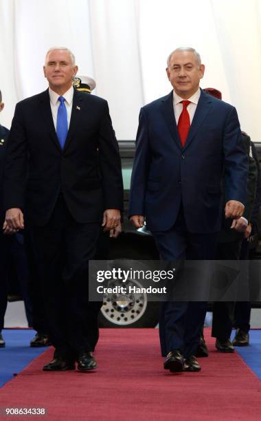 In this handout photo provided by the Israel Government Press Office , US vice President Mike Pence walks with Israeli Prime Minister Benjamin...