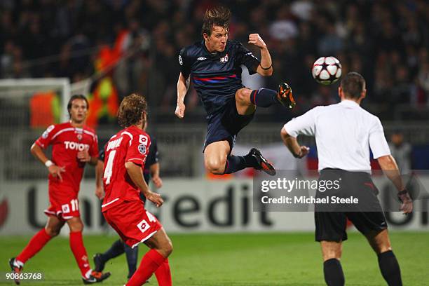 Kim Kallstrom of Lyon leaps to control the ball during the UEFA Champions League Group E match between Lyon and Fiorentina at the Stade de Gerland on...