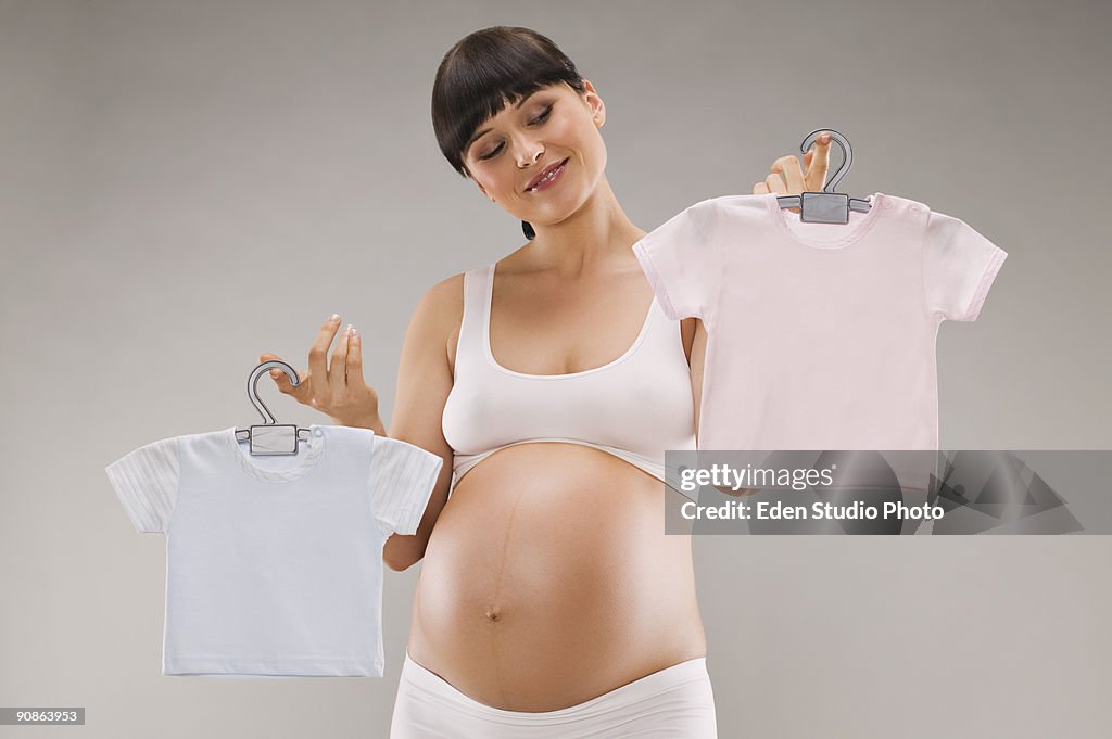 Pregnant woman with shirts