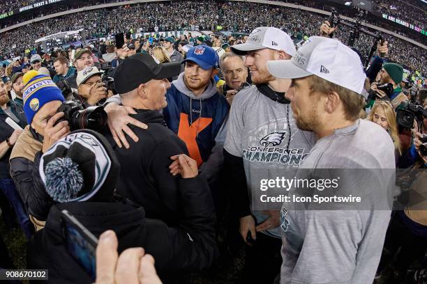 Philadelphia Eagles quarterback Nick Foles and Philadelphia Eagles quarterback Carson Wentz celebrate with each other, fans and teammates after the...