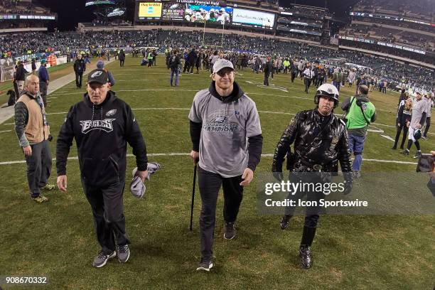 Philadelphia Eagles quarterback Carson Wentz celebrates with fans and teammates after the NFC Championship Game between the Minnesota Vikings and the...