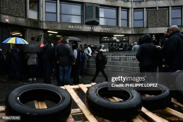 Striking prison guards demonstrate outside the Fleury-Merogis prison on January 22 as part of a nationwide movement to call for for better safety and...