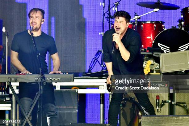 Singers Ben Lovett and Marcus Mumford of the band Mumford & Sons perform onstage during the iHeartRadio ALTer EGO concert at The Forum on January 19,...