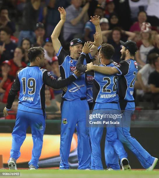 Adelaide Strikers Ben Laughlin and Jake Weatherald celebrate combining to catch Renegades Dwayne Bravo during the Big Bash League match between the...