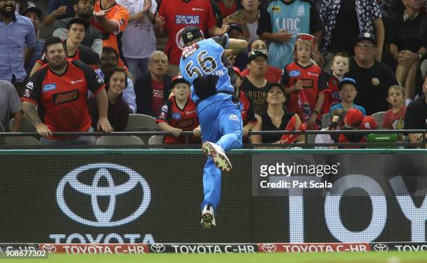 Adelaide Strikers Ben Laughlin takes a catch which he then threw to Jake Weatherald to dismiss Renegades Dwayne Bravo during the Big Bash League...