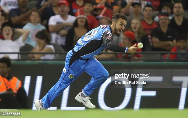 Adelaide Strikers Jake Weatherald takes a catch thrown to him by Ben Laughlin to dismiss Renegades Dwayne Bravo during the Big Bash League match...