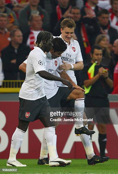 Eduardo of Arsenal celebrates his goal with Nicklas Bendtner and Alexandre Song during the UEFA Champions League Group H match between Standard Liege...