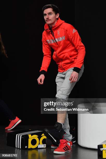 Richard Freitag tries on shoes during the 2018 PyeongChang Olympic Games German Team kit handover at Postpalast on January 22, 2018 in Munich,...