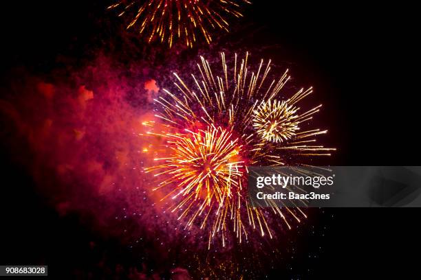 low angle view of firework exploding in sky - new year 2018 stock pictures, royalty-free photos & images