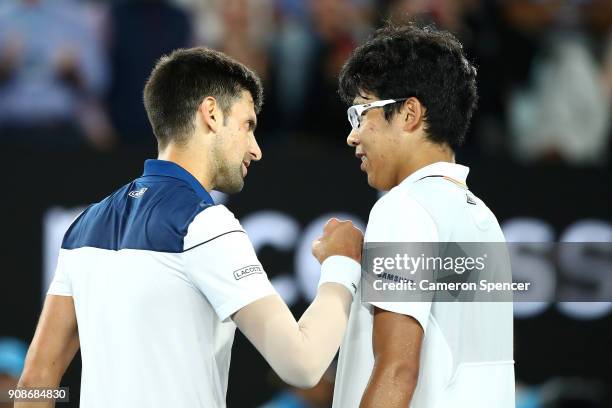 Novak Djokovic of Serbia congratulates Hyeon Chung of South Korea after losing their fourth round match on day eight of the 2018 Australian Open at...