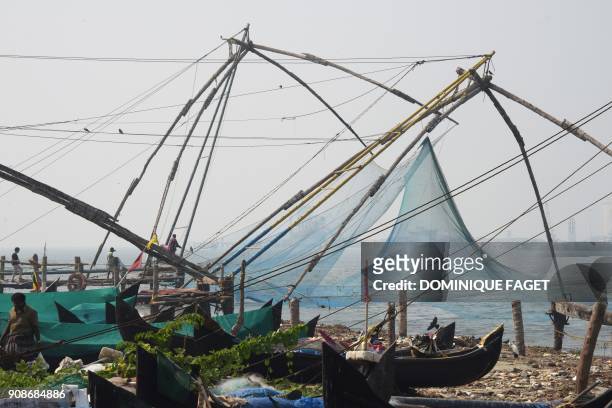 This photograph taken on January 6, 2018 shows 'Chinese fishing nets' on the shores of Fort Kochi, in the southern Indian state of Kerala. / AFP...