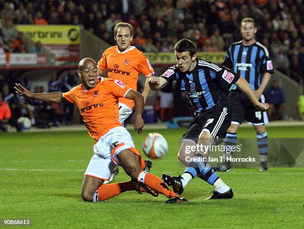 Joey Barton shot is blocked by Alex Baptiste during the Coca-Cola League Championship match between Blackpool and Newcastle United at Bloomfield Road...