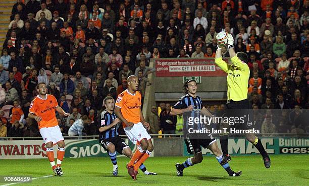 Goalkeeper Paul Rachubka of Blackpool claims the ball ahed of Andy Carroll of Newcastle United during the Coca-Cola League Championship match between...